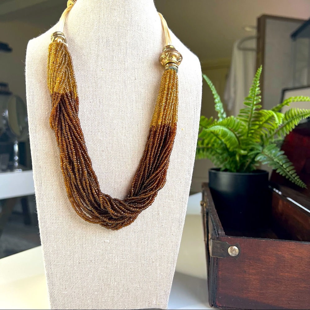 Brown and gold needed ropes necklace.
